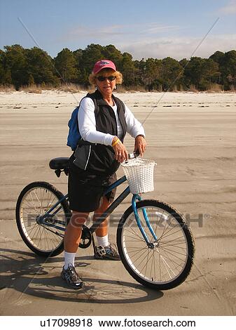 woman biking on the beach, Hilton Head Island, Low Country, South Carolina, SC, Atlantic Ocean View Large Photo Image Stock Photo - woman biking on the beach, Hilton Head Island, Low Country, South Carolina, SC, Atlantic Ocean. Fotosearch