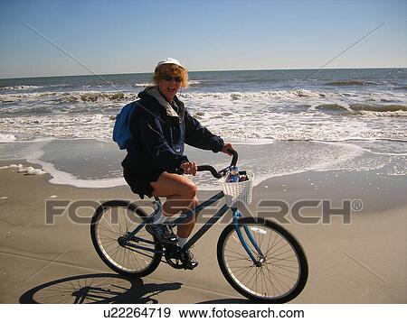 woman biking on the beach, Hilton Head Island, Low Country, South Carolina, SC, Atlantic Ocean View Large Photo Image Stock Photo - woman biking on the beach, Hilton Head Island, Low Country, South Carolina, SC, Atlantic Ocean. Fotosearch