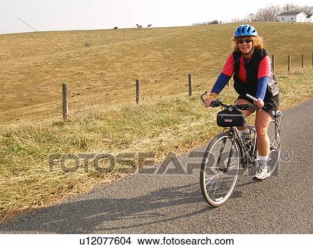woman, biking, road, Galax, Virginia, VA View Large Photo Image Picture - woman, biking, road, Galax, Virginia, VA. Fotosearch