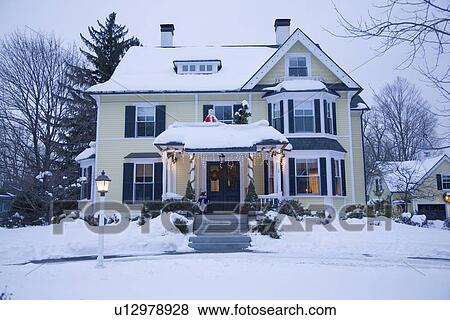 Stock Photo - Christmas Home with Lights in New England. Fotosearch