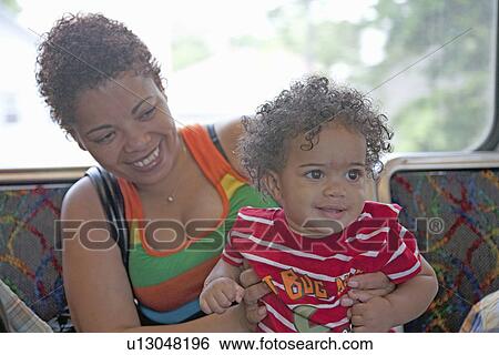 Stock Photograph - Hispanic Mother and Child, Boston, MA.. Fotosearch