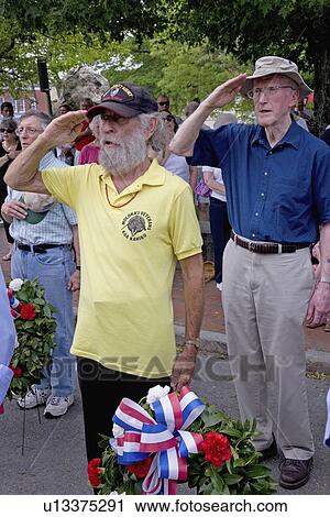 Stock Image - Veterans Salue during Memorial Day Parade, Concord, MA. Fotosearch