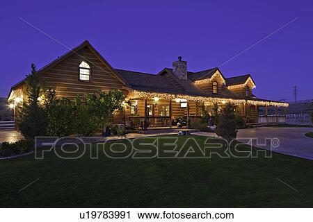 Angular view of ranch home at dusk View Large Photo Image Stock Image - Angular view of ranch home at dusk. Fotosearch