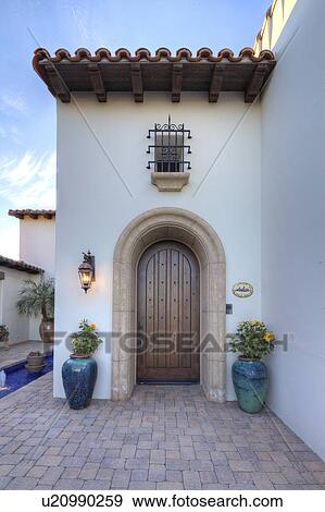 Stock Photo - Arched doorway to luxury villa. Fotosearch
