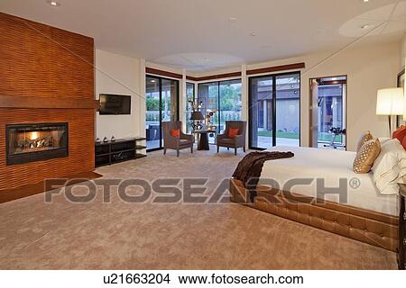 Picture - Bedroom interior with fireplace. Fotosearch