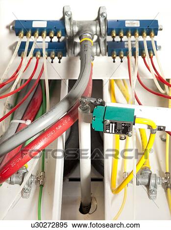 Stock Photography - Cables and wires on a machine. Fotosearch