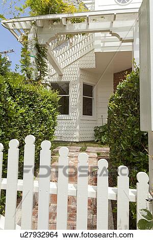 Picture - Close gate with path leading to front door. Fotosearch