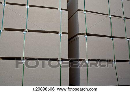 Stock Photograph - Close up of luxury wooden planks in warehouse. Fotosearch