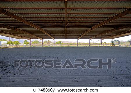 Stock Photo - Covered Horse training area. Fotosearch