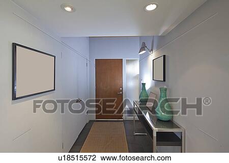 Entry with paintings and side table View Large Photo Image Stock Image - Entry with paintings and side table. Fotosearch