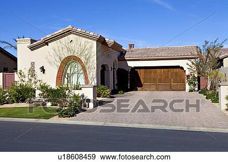 Stock Photo - Façade of bungalow across the road. Fotosearch