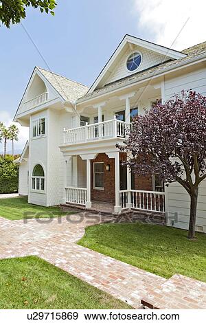 Stock Photo - Façade of traditional stylish house. Fotosearch