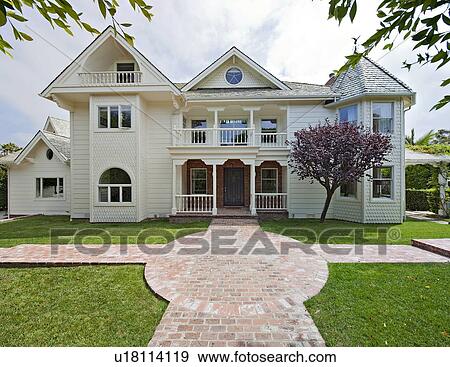 Front view of Façade of traditional stylish house View Large Photo Image Stock Photo - Front view of Façade of traditional stylish house. Fotosearch