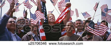 Group of multi-ethnic people with American flags celebrating Independence Day(US) View Large Photo Image Stock Photograph - Group of multi-ethnic people with American flags celebrating Independence Day(US). Fotosearch
