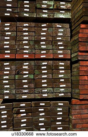 Hardwood stacked in a warehouse View Large Photo Image Stock Photo - Hardwood stacked in a warehouse. Fotosearch