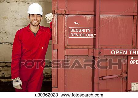 Hispanic worker opening industrial railway carriage View Large Photo Image Stock Image - Hispanic worker opening industrial railway carriage. Fotosearch