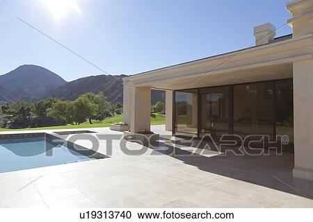 House exterior with pool and view of mountains View Large Photo Image Stock Image - House exterior with pool and view of mountains. Fotosearch