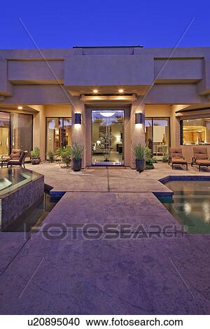 House exterior with pool at dusk View Large Photo Image Stock Image - House exterior with pool at dusk. Fotosearch