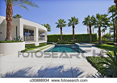 House Exterior with swimming pool View Large Photo Image Picture - House Exterior with swimming pool. Fotosearch