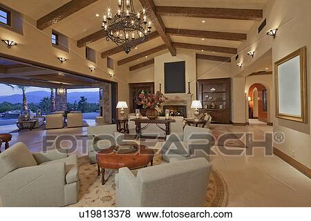 Interior of large open plan living room opening to patio View Large Photo Image Stock Photo - Interior of large open plan living room opening to patio. Fotosearch