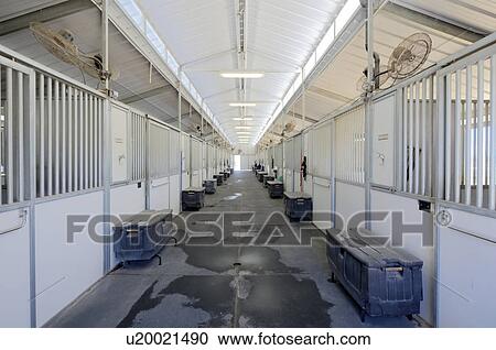 Stock Image - Interior of stables. Fotosearch