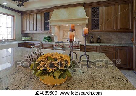 Stock Photo - Kitchen bench with flowers. Fotosearch