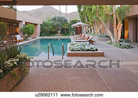 Looking outside to residential pool View Large Photo Image Stock Image - Looking outside to residential pool. Fotosearch