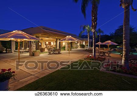 Looking over patio to outdoor seating area of luxury home View Large Photo Image Stock Image - Looking over patio to outdoor seating area of luxury home. Fotosearch