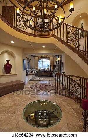 Luxurious foyer with staircase of spacious home View Large Photo Image Picture - Luxurious foyer with staircase of spacious home. Fotosearch