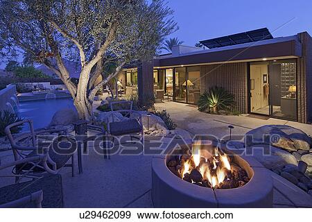 Outdoor fire place by a pool View Large Photo Image Stock Photo - Outdoor fire place by a pool. Fotosearch