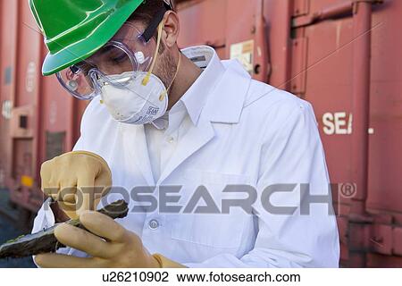 Safety inspector holding biological material View Large Photo Image Stock Image - Safety inspector holding biological material. Fotosearch