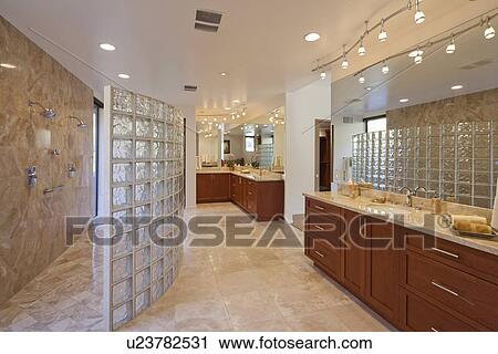 Stock Image - Shower, sink and counter in Bathroom. Fotosearch