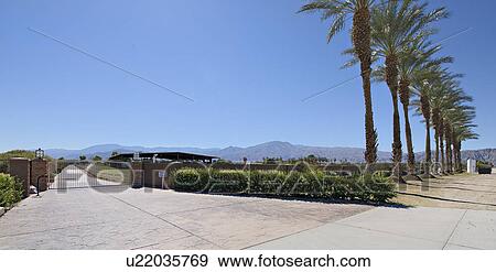 Stock Photo - View of driveway entrance to ranch. Fotosearch