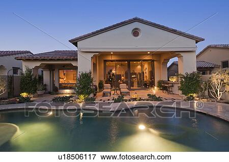 View of swimming pool and exterior of luxury villa View Large Photo Image Stock Photo - View of swimming pool and exterior of luxury villa. Fotosearch