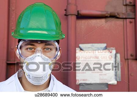 Worker in hazmat suit, hard-hat and face mask View Large Photo Image Stock Image - Worker in hazmat suit, hard-hat and face mask. Fotosearch