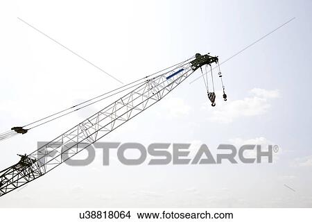 Close-up view of crane against sky View Large Photo Image Picture - Close-up view of crane against sky. Fotosearch