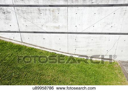 Grass verge next to brick wall View Large Photo Image Stock Photograph - Grass verge next to brick wall. Fotosearch