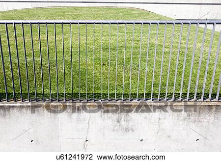 Metal railings in front of grass View Large Photo Image Stock Image - Metal railings in front of grass. Fotosearch