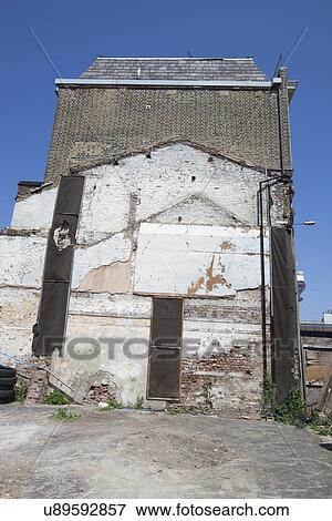Remaining outline of a building after it was torn down View Large Photo Image Stock Photo - Remaining outline of a building after it was torn down. Fotosearch