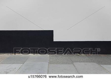 Stock Photograph - Tiled floor and wall of terrace against clear sky. Fotosearch
