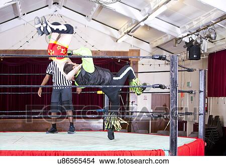 Picture - Young men wrestling in ring. Fotosearch