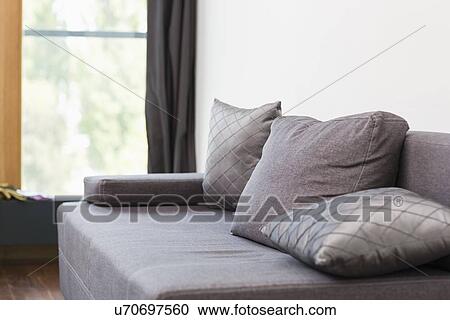 Gray sofa with cushions in house View Large Photo Image Stock Image - Gray sofa with cushions in house. Fotosearch