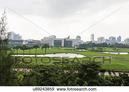 The 18 hole golf course at Royal Bangkok Sports Club in the middle of Bangkok City, Thailand View Large Photo Image Stock Photo - The 18 hole golf course at Royal Bangkok Sports Club in the middle of Bangkok City, Thailand. Fotosearch