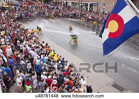 Colorado flag hangs as men dressed in yellow firemen slickers and firehoses have annual Waterfight on July 4, Ouray, CO View Large Photo Image Stock Photo - Colorado flag hangs as men dressed in yellow firemen slickers and firehoses have annual Waterfight on July 4, Ouray, CO. Fotosearch