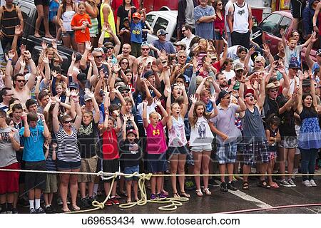Crowd with handsup at annual July 4, Ouray, CO Waterfight View Large Photo Image Picture - Crowd with handsup at annual July 4, Ouray, CO Waterfight. Fotosearch