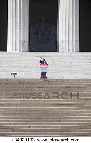 Stock Image - Georgia Congressman John Lewis waves at the National Action to Realize the Dream march and rally commemorating the 50th Anniversary of the march on Washington, D. C.. Fotosearch
