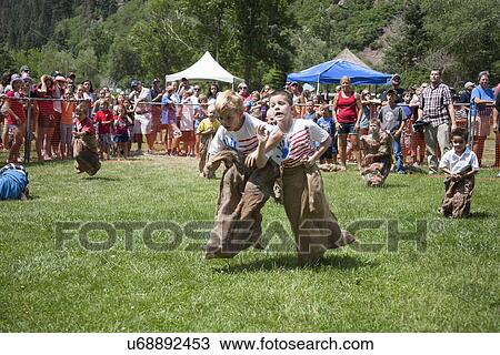 July 4, Indpendence Day, kids compete in Three Legged race in Ouray, Colorado View Large Photo Image Stock Image - July 4, Indpendence Day, kids compete in Three Legged race in Ouray, Colorado. Fotosearch
