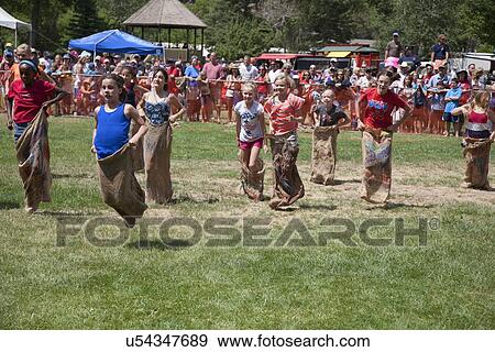 Stock Photo - July 4, Indpendence Day, kids compete in Three Legged race in Ouray, Colorado. Fotosearch