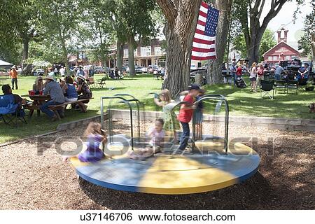 Kids spin on playground in Town Park, Ridgway, Colorado View Large Photo Image Stock Photograph - Kids spin on playground in Town Park, Ridgway, Colorado. Fotosearch