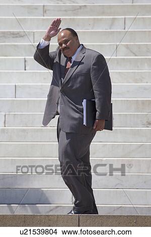 Picture - Martin Luther King III waves at the National Action to Realize the Dream march and rally commemorating the 50th Anniversary of the march on Washington, D. C.. Fotosearch